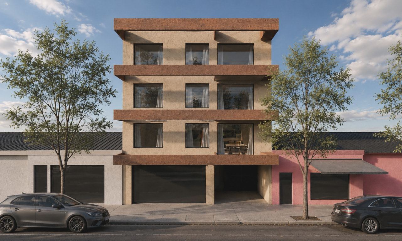 Façade of the building in Campana: four storeys edged in terracotta, a ground floor with a roller shutter and an open vehicle passage, and trees along the pavement.